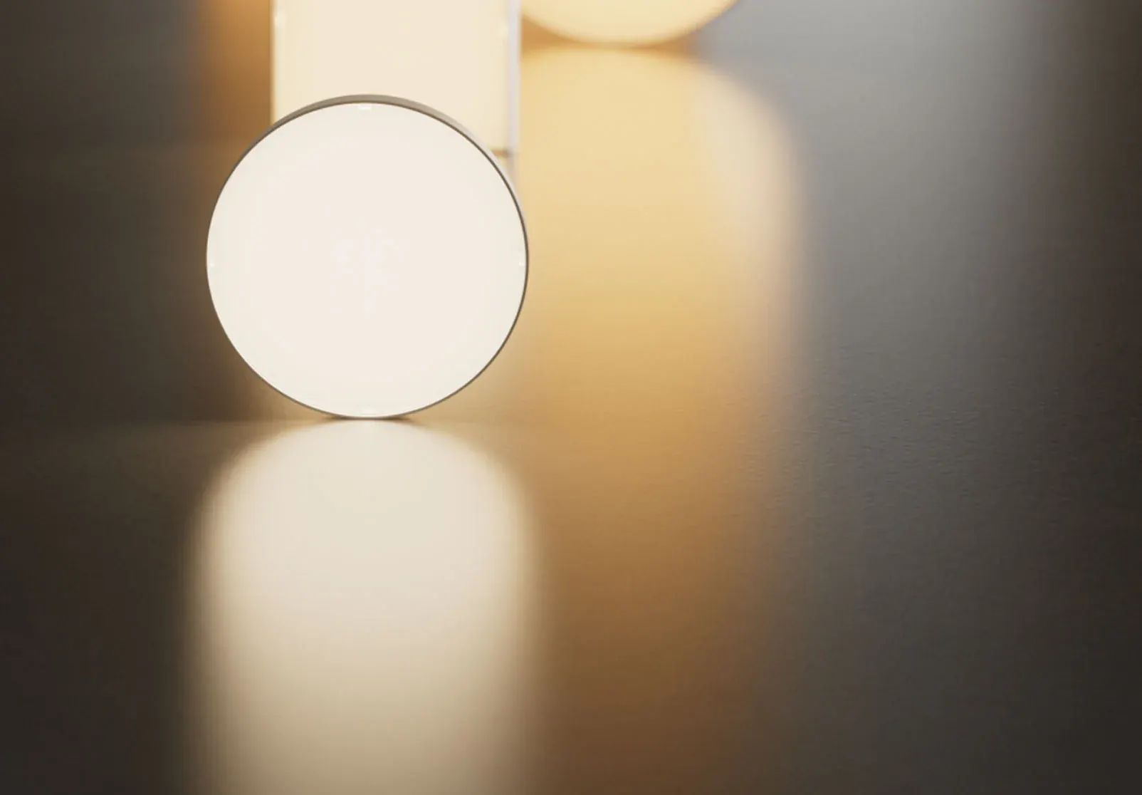 DMF cylinder on a wall casting light up and down