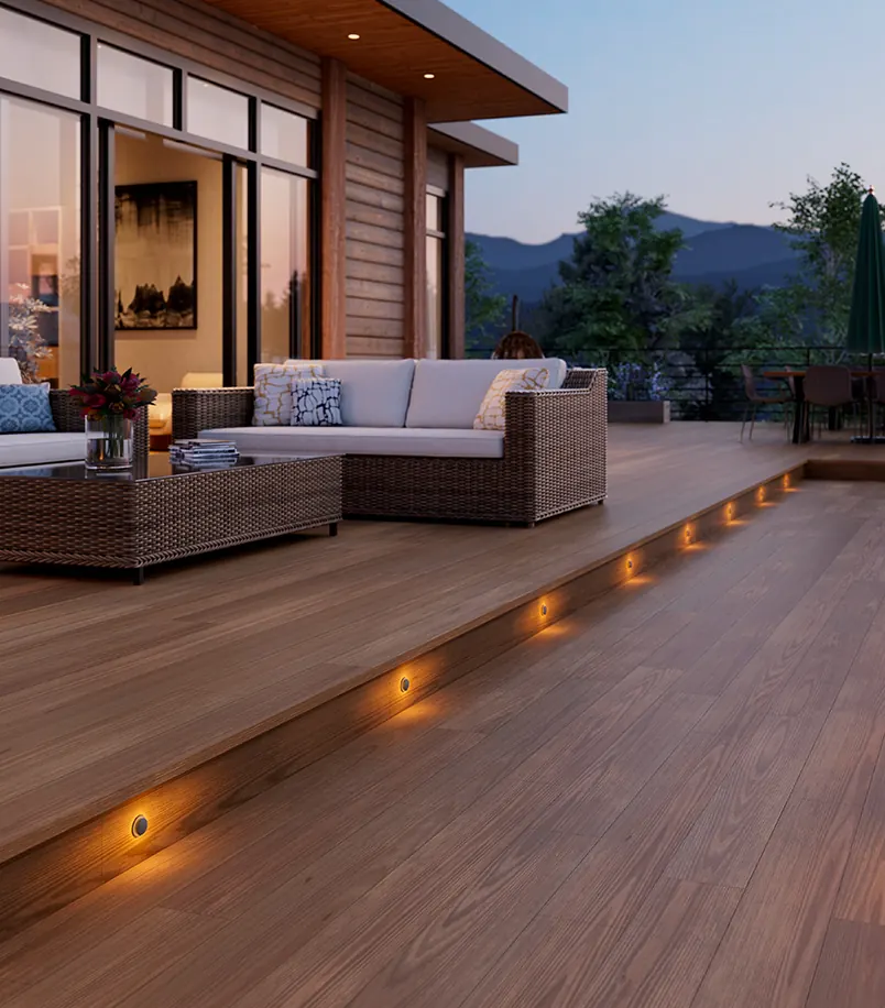 Wood deck with small step lights set into the edge at dusk